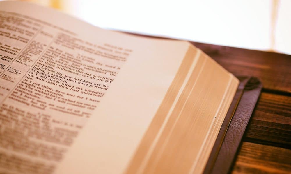 book page on top of brown surface